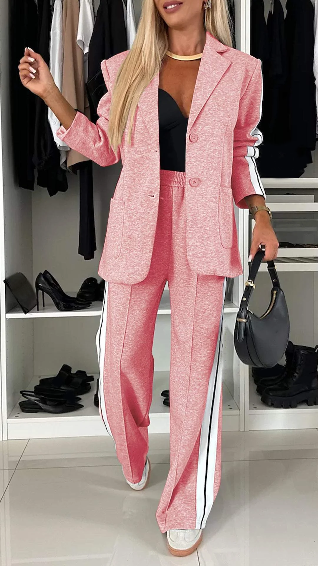 Fashionable women's two-piece set with bold sporty stripes and a chic design.