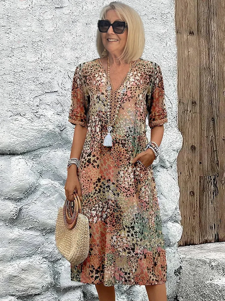 Women's vibrant A-line midi dress with tummy coverage, perfect for elegant summer wear.