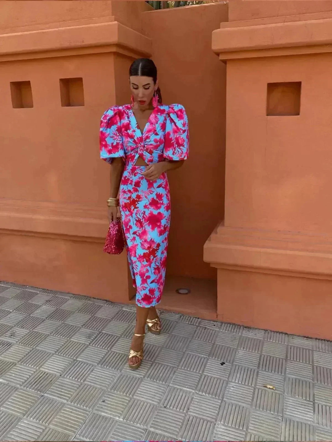 Stylish women's midi dress showcasing a vibrant abstract print, chic puff sleeves, and a flattering V-neck.