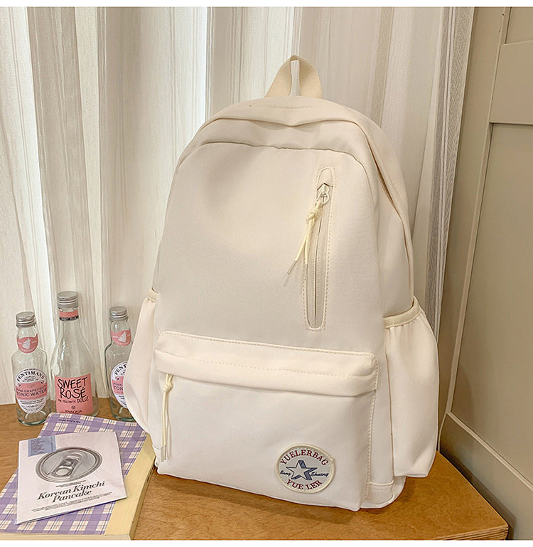 Unisex lightweight school backpack in a bright hue, featuring front zip pockets for easy access to essentials.