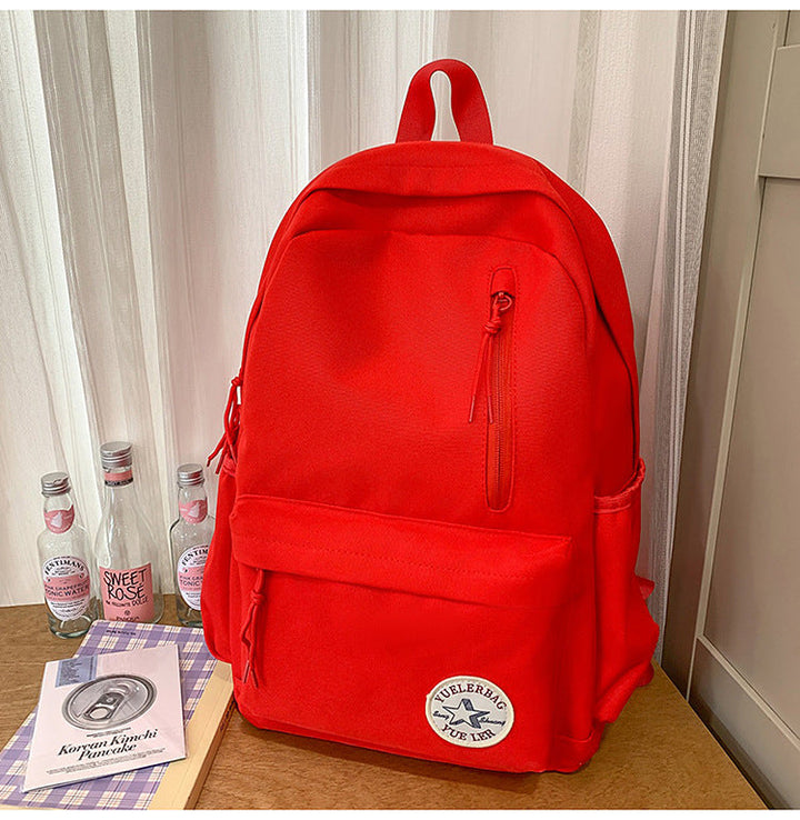 Lightweight daily use backpack with roomy main compartment and internal organizer pockets for school supplies.