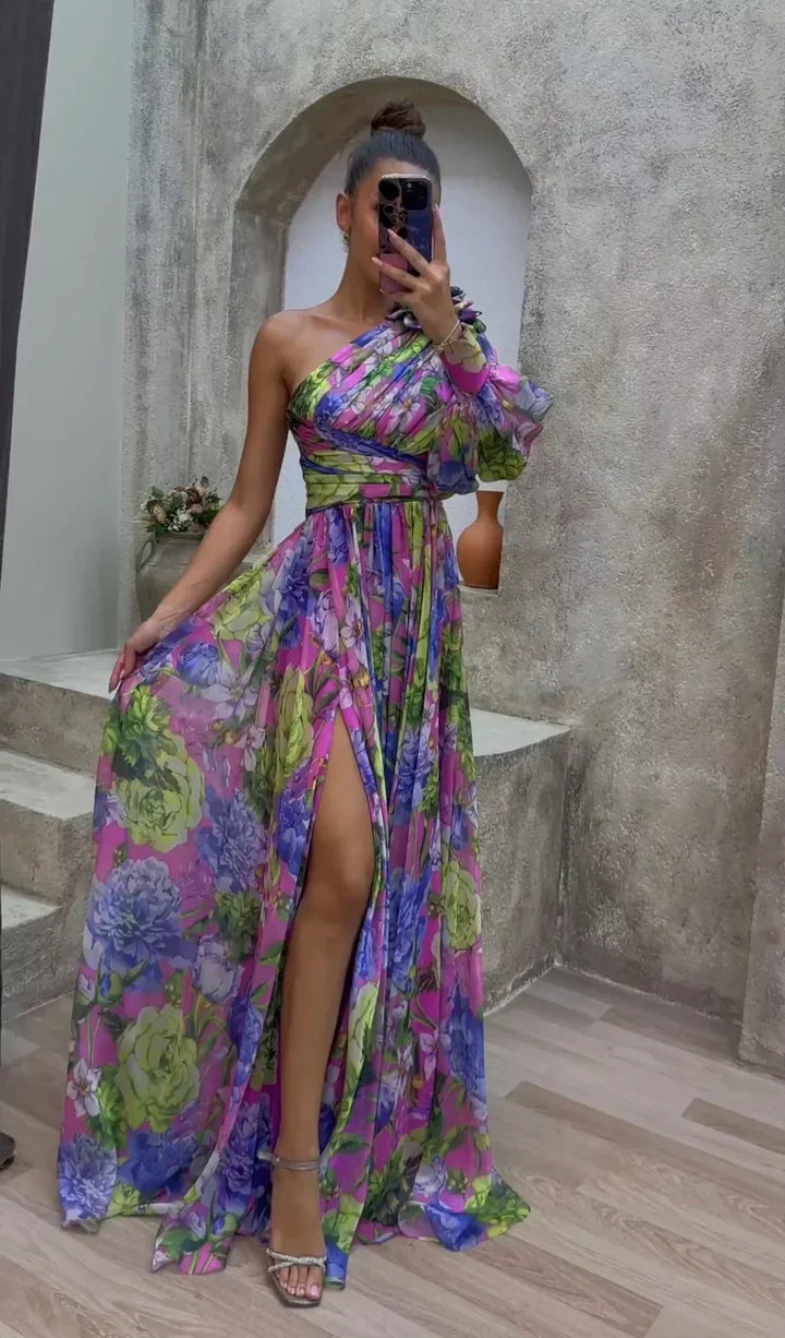 Vibrant one-shoulder floral maxi dress for women with an elegant split hem, perfect for summer parties & vacations.