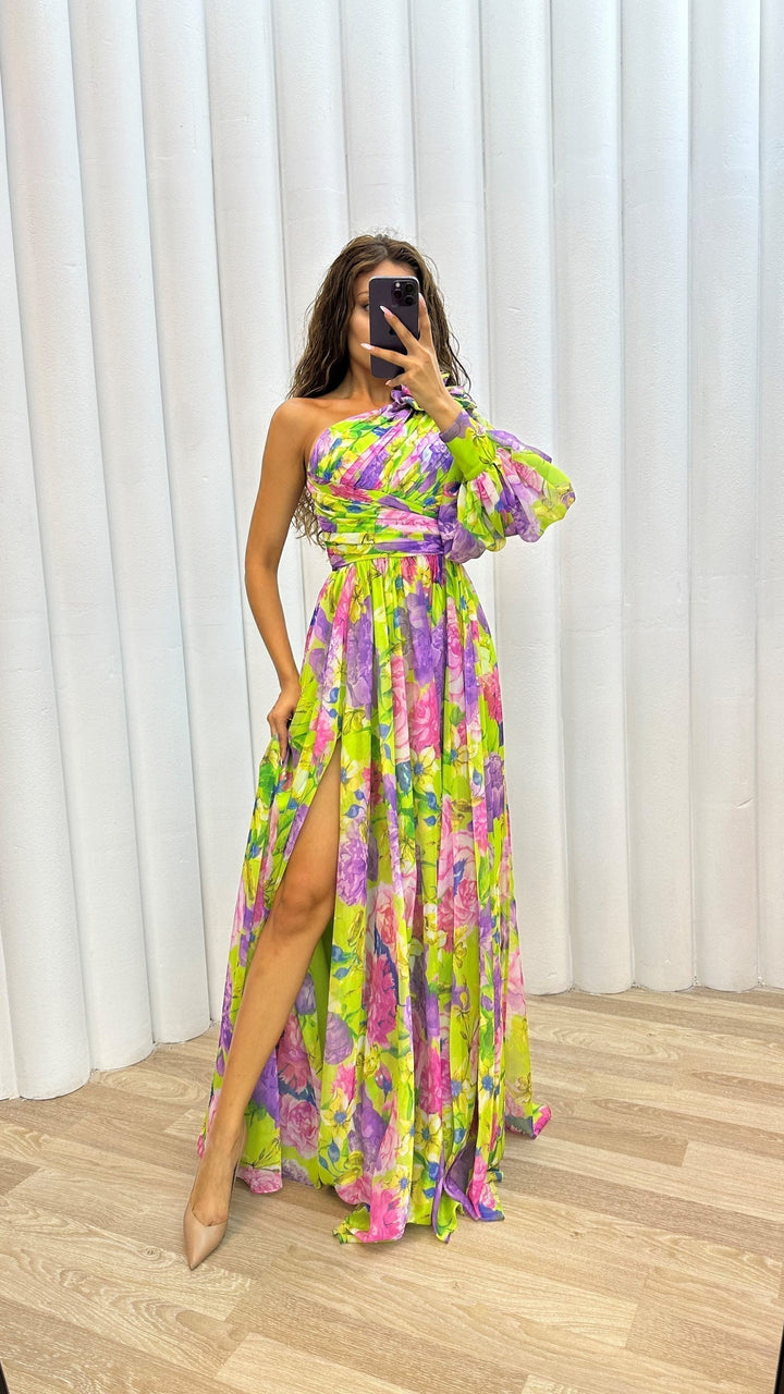Flowing women's one-shoulder maxi dress with a bold floral print & stylish split, great for beach or evening.