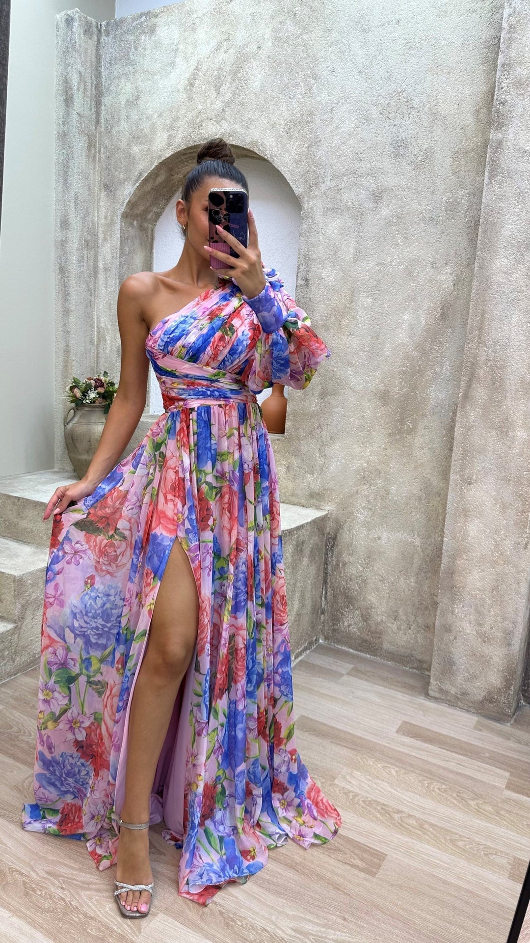 Eye-catching women's floral one-shoulder maxi dress, vibrant for summer, with a high split for movement.