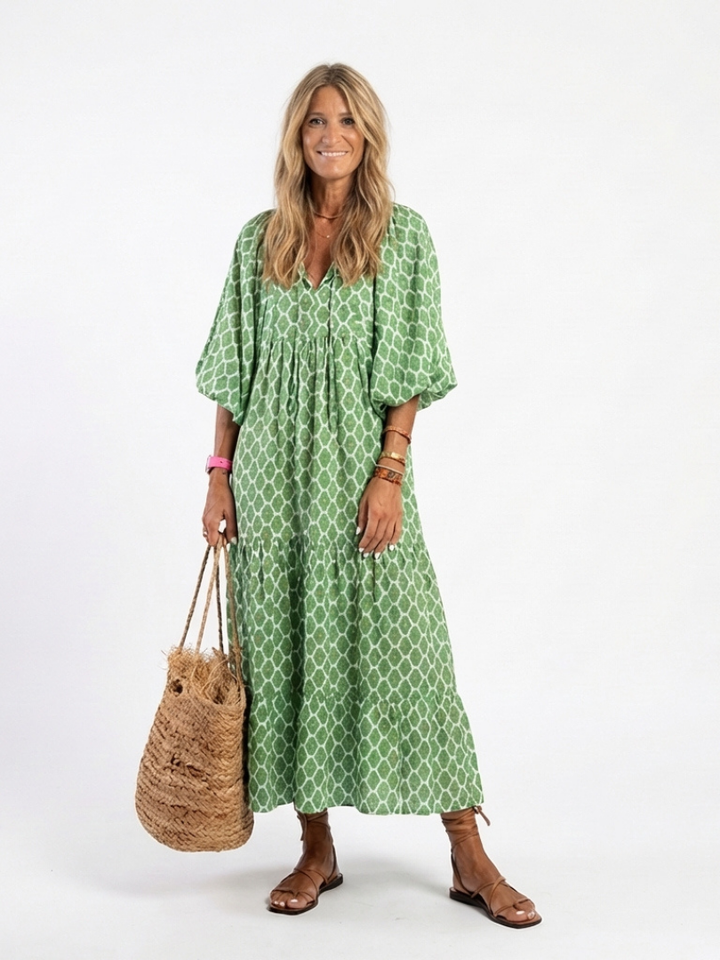 Vibrant patterned V-neck midi dress for women, featuring elegant three-quarter sleeves & a relaxed fit.