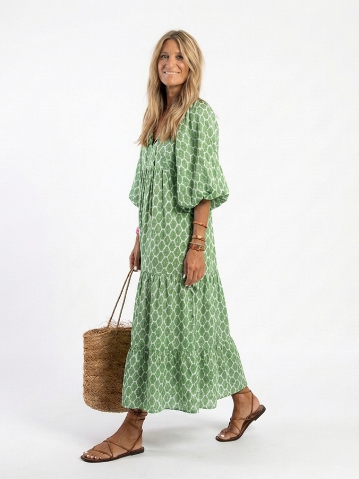 Green patterned V-neck midi dress with three-quarter sleeves, a comfortable & stylish casual summer outfit.