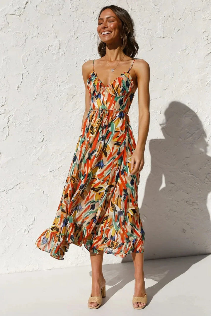 Vibrant women's abstract print v-neck sleeveless midi dress, flowy & colorful for summer casual wear. Trendy.