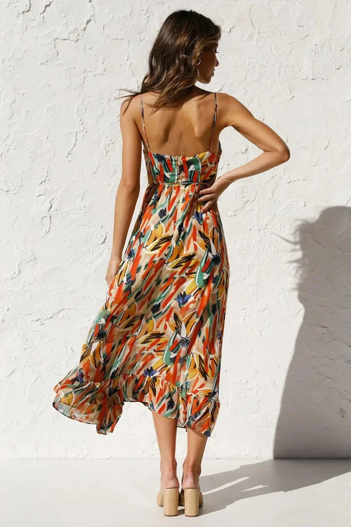 Colorful abstract print midi dress for women, chic v-neck & sleeveless design. Perfect flowy summer occasion wear.