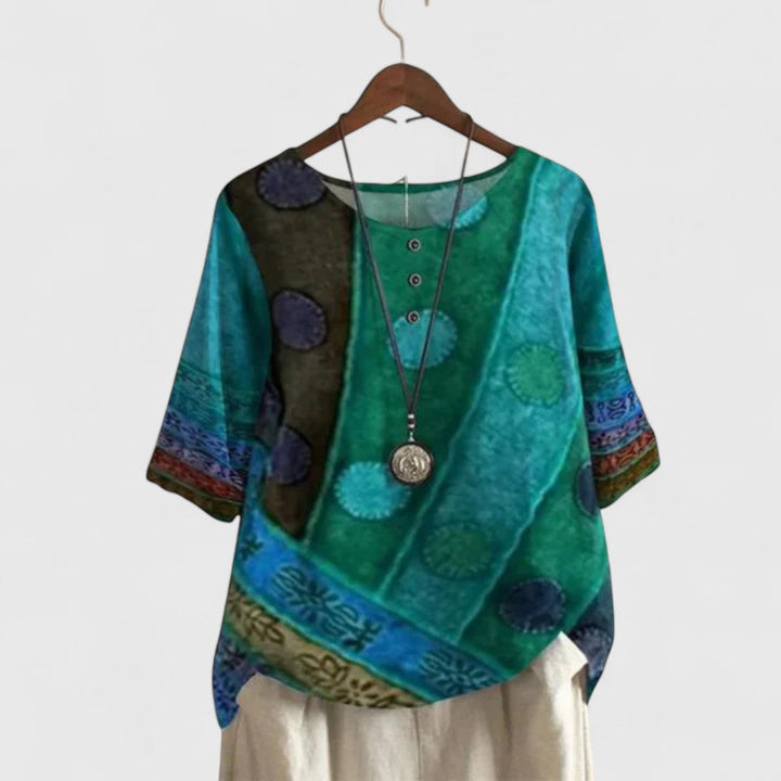 Unique women's boho long sleeve top with vibrant patchwork print. Comfortable and stylish for travel or everyday fashion.