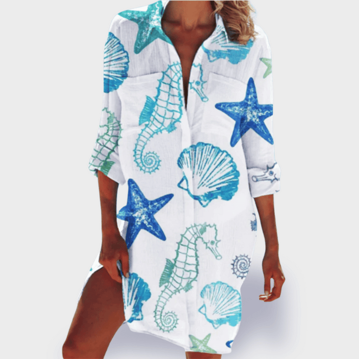 Flowy women's summer dress, colourful & lightweight, ideal for holiday wear, beach days or vibrant casual outfits.
