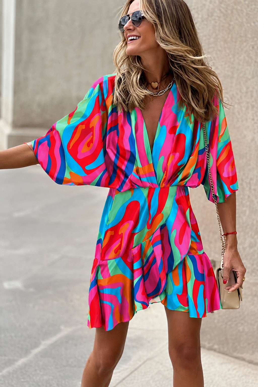 Comfortable women's short sleeve V-neck mini dress with a stylish paisley print. Perfect flowy summer or casual party dress.