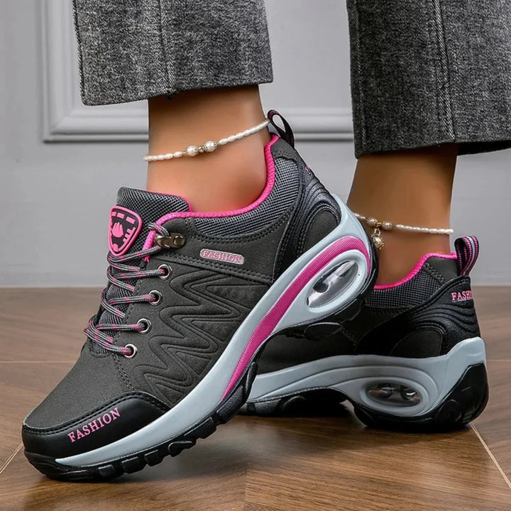 Vibrant women's water-resistant hiking shoes, ideal for trails. Comfortable, anti-slip, lightweight outdoor adventure gear.