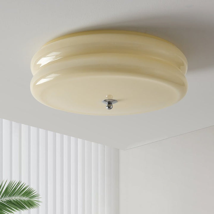 Dimmable vintage Art Deco ceiling fixture with ribbed fluted glass design.