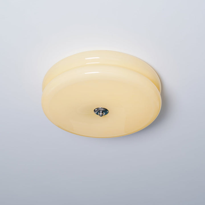 Ceiling light fixture with intricate fluted glass, Art Deco era design.