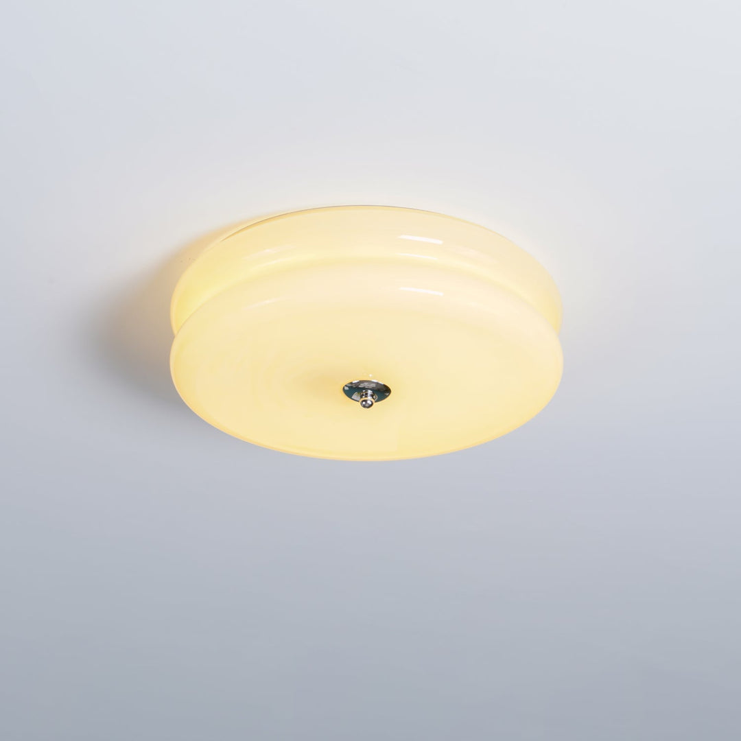Dimmable fluted glass Art Deco ceiling light, providing warm ambient illumination.
