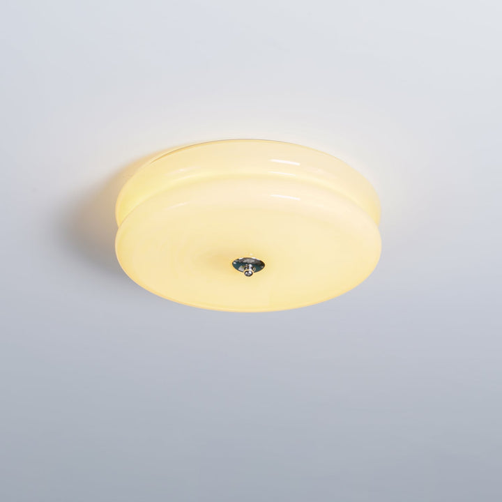 Dimmable fluted glass Art Deco ceiling light, providing warm ambient illumination.