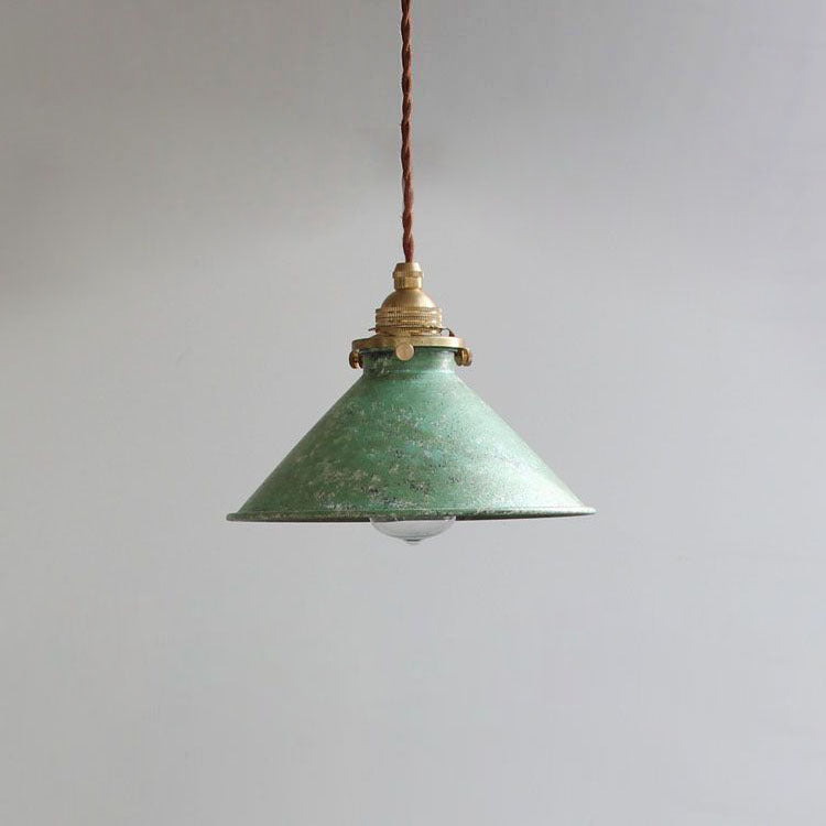 Stylish metal cone pendant light enhancing a dining room, kitchen island, or bedroom decor.