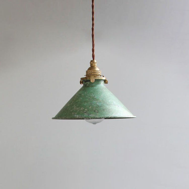 Stylish metal cone pendant light enhancing a dining room, kitchen island, or bedroom decor.