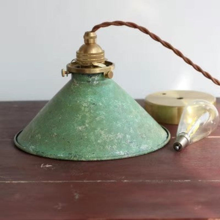 Modern vintage metal cone pendant light, an adjustable ceiling fixture for various home lighting needs.