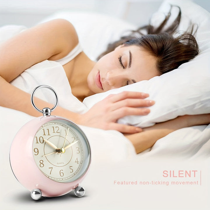 Retro silent alarm clock in light green, ideal for a peaceful bedroom