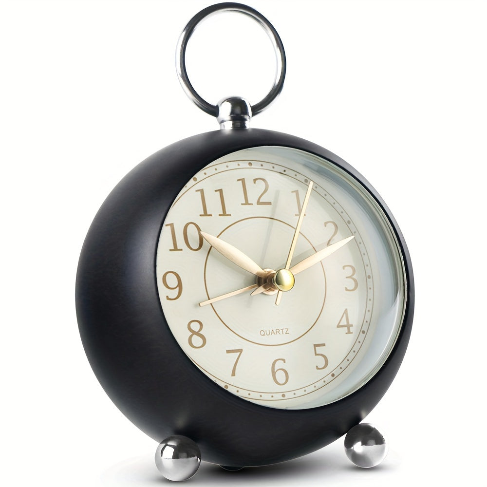 A vintage cyan analogue alarm clock with a functional night light