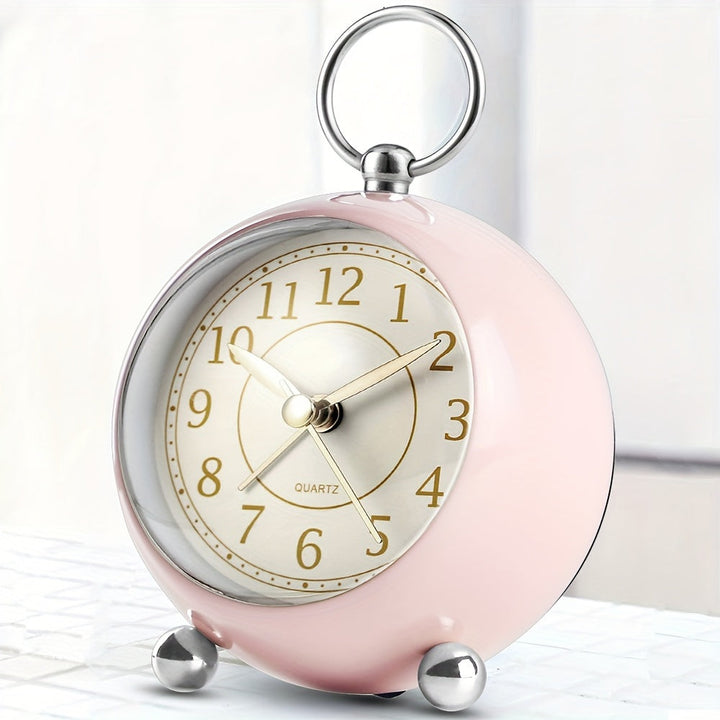 Close-up of vintage cyan alarm clock showing its silent operation