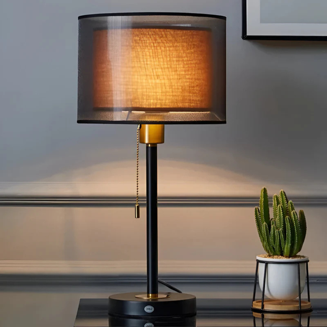 Vintage double fabric shade table lamp, warm ambient light, black bronze finish.