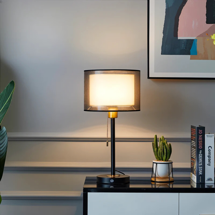 Elegant vintage table lamp featuring a double fabric shade, perfect for warm ambient light.