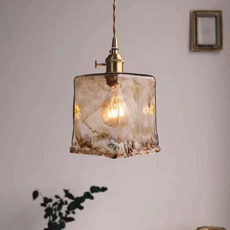 Modern vintage pendant light with geometric brass cage, ambient ceiling lamp for cozy spaces.