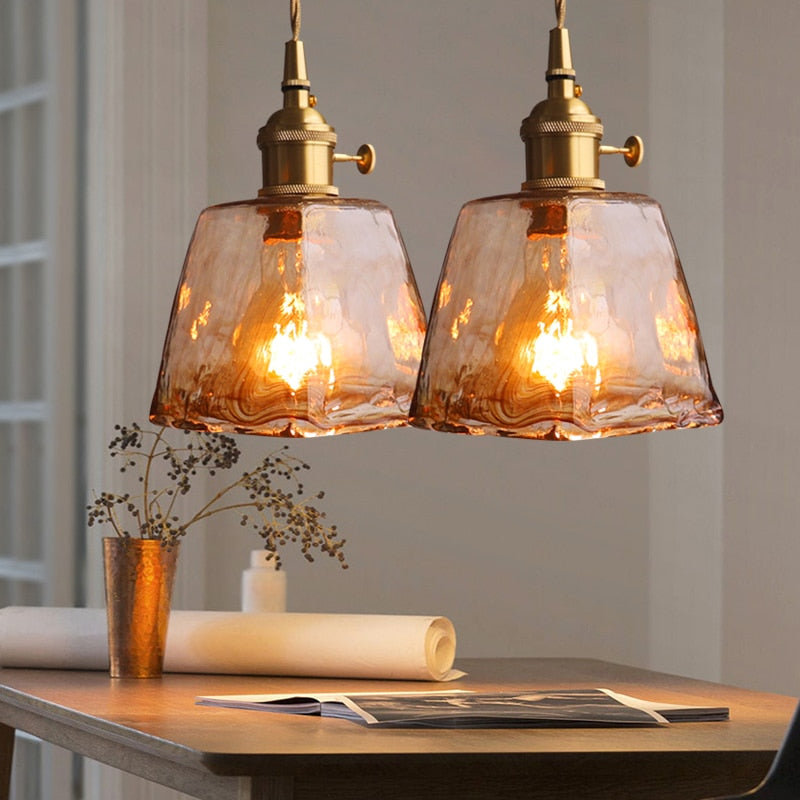 Brass finish vintage geometric pendant light, ideal home decor for ambient lighting.