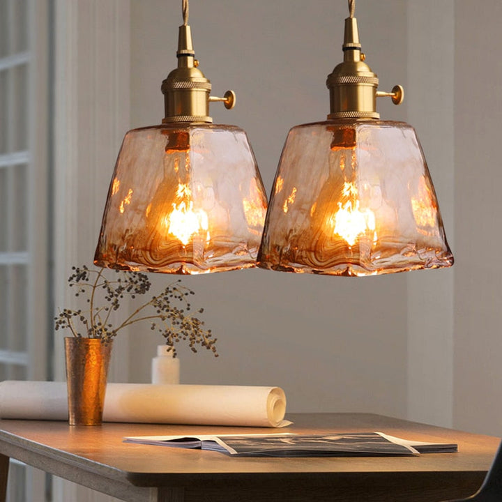 Brass finish vintage geometric pendant light, ideal home decor for ambient lighting.