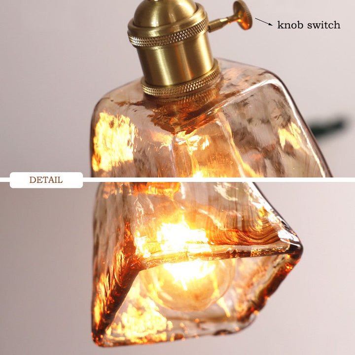 Decorative geometric pendant light, vintage style, with a sophisticated brass finish.