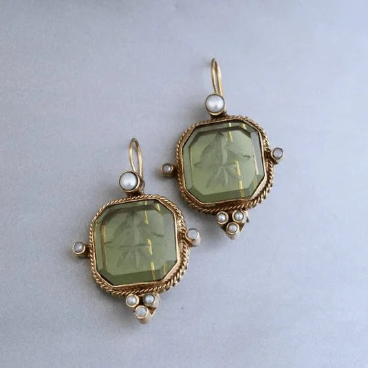 Vintage gold-tone octagonal earrings for women, featuring an elegant green stone. Perfect statement fashion jewelry.