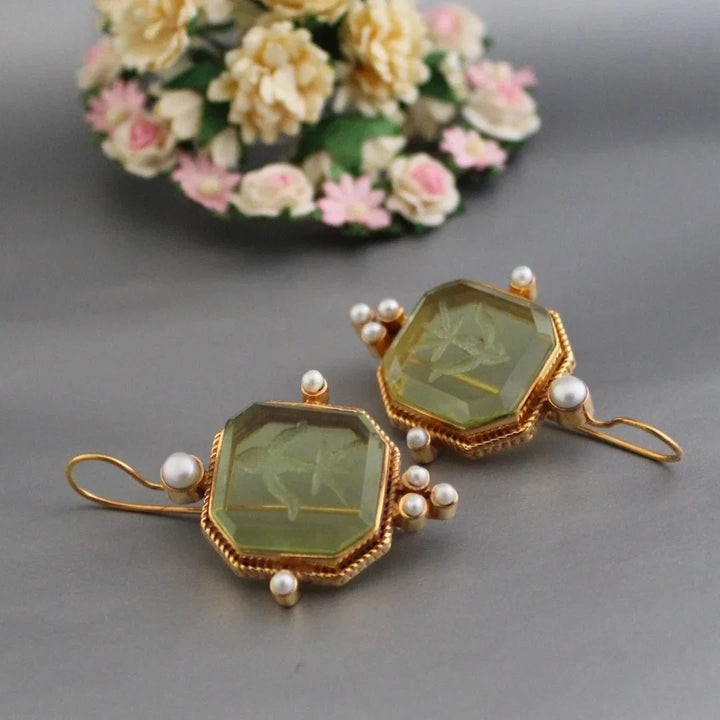 Elegant women's vintage gold-tone octagonal earrings with a prominent green stone. Stylish fashion jewelry gift.