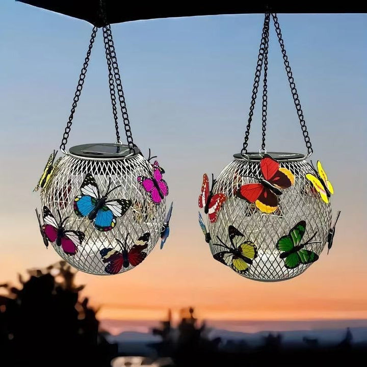 Durable solar hanging lantern, vintage LED, black metal cage, waterproof for all-weather garden lighting.