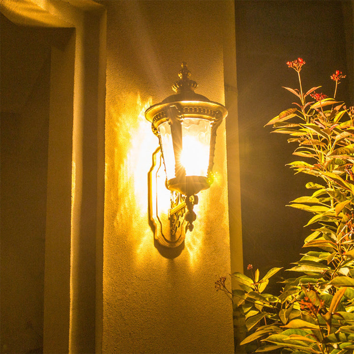 Vintage outdoor wall light fixture, classic glass, aluminum, ideal for porches, patios & entryways.