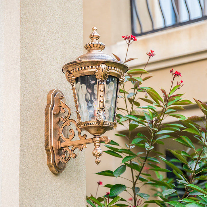 Decorative vintage outdoor wall light fixture, aluminum frame & clear glass, for porch or garden.