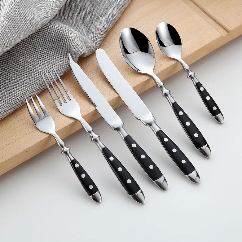 Vintage stainless steel cutlery set, elegant flatware for dining, classic design with resin handles.