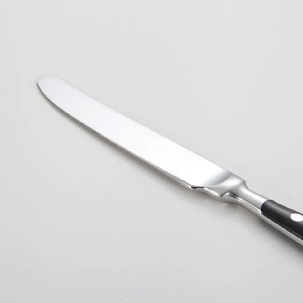 Premium vintage stainless steel dining utensils, a complete flatware set for stylish table settings.