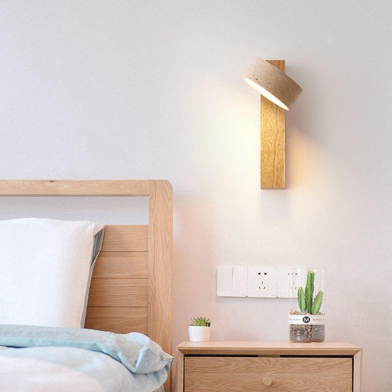 Textured travertine & wood LED wall lamp. Wabi Sabi design providing gentle, ambient lighting for relaxation.