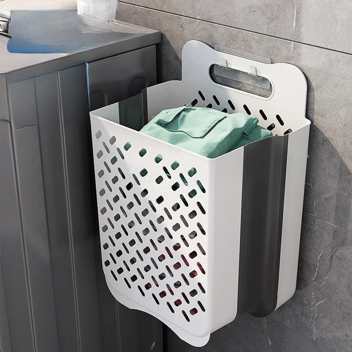 Space-saving wall-mounted mesh laundry hamper, ideal for dorm rooms or utility rooms to organize dirty clothes.