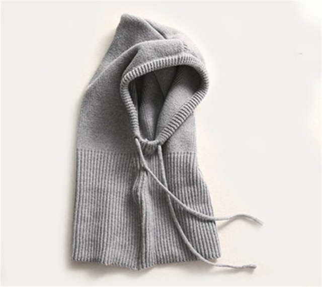 Cozy thermal knit hat featuring a hood, perfect for outdoor winter activities.