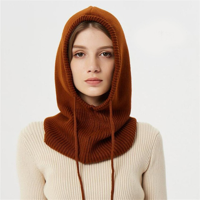 Stay warm this winter with our thermal insulated knit beanie hat with a hood.