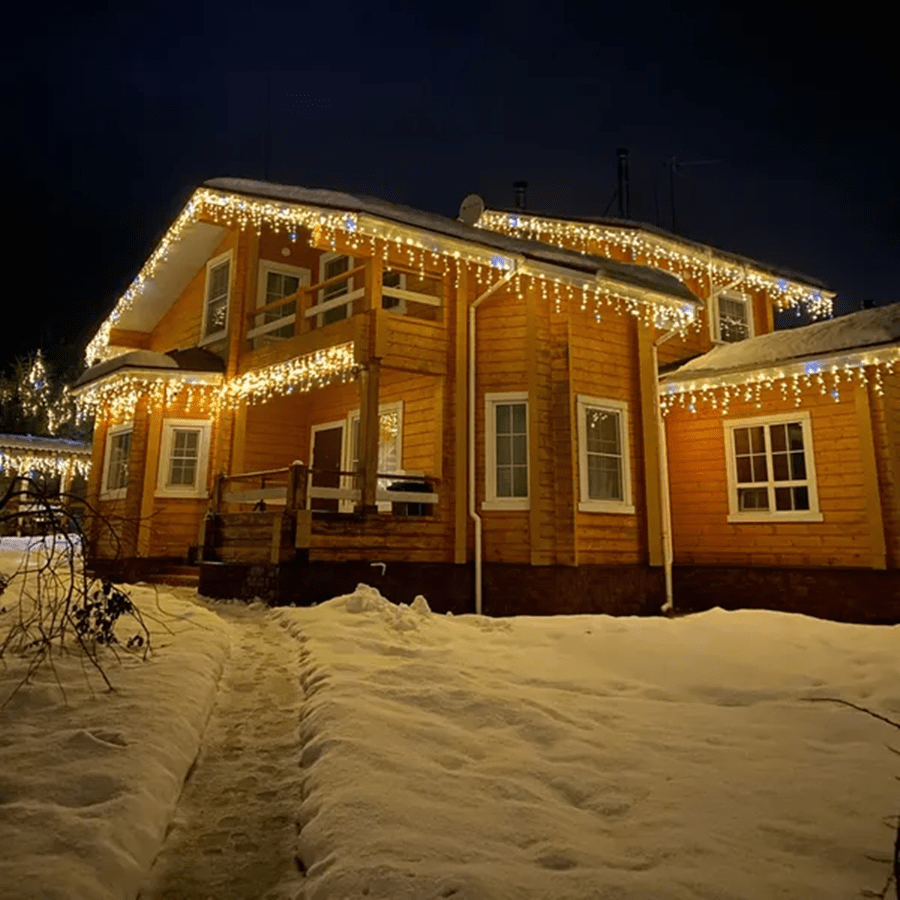 Close-up of warm LED curtain string lights adding ambiance to outdoor spaces.