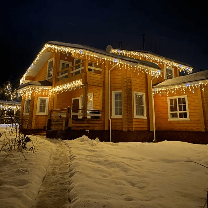 Close-up of warm LED curtain string lights adding ambiance to outdoor spaces.