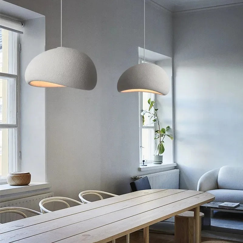 Elegant ambient light fixture: Wasabi pendant with sculpted dome shape.