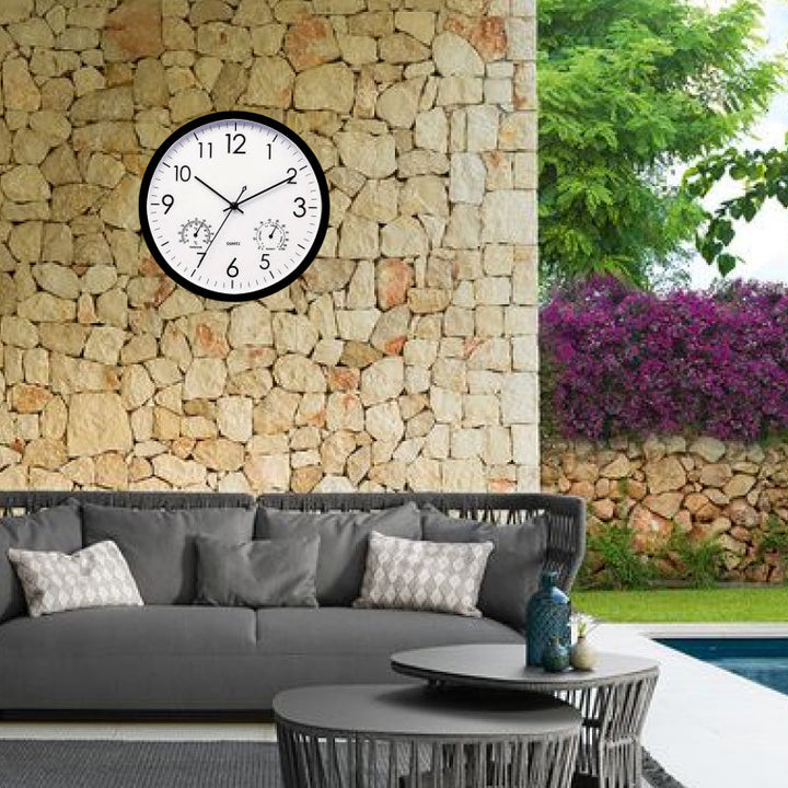 Stylish weatherproof outdoor clock & temperature gauge, adding vintage charm to any garden wall or patio.