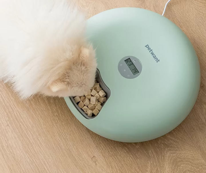 Smart digital pet food dispenser in white, offering precise, effortless feeding for dogs & cats.
