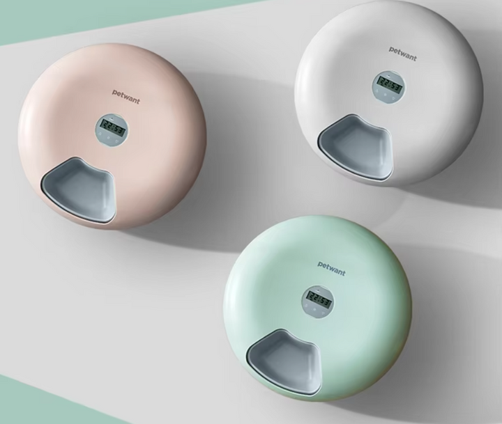 White smart digital automatic pet feeder for precise, timed dog & cat meals. Modern pet care solution.
