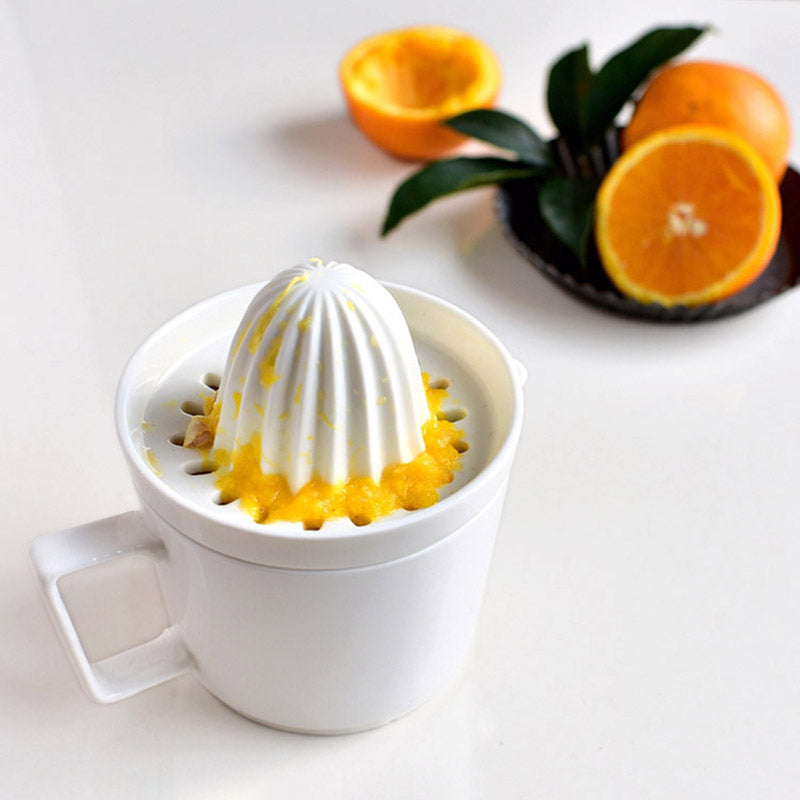 Stylish ceramic citrus press for making fresh orange juice. Easy to clean and durable kitchen essential.